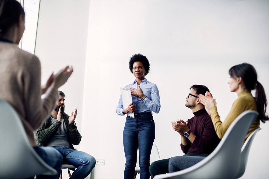 therapist leading group therapy for addiction in a recovery program